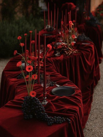 Red draped table setting mood reference